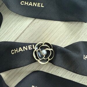 CHANEL Black & Gold Ribbon & 2023 Camellia Holiday Ribbon Pin